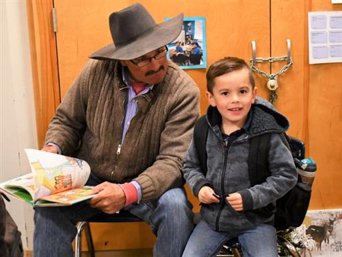 dad reading with his child 
